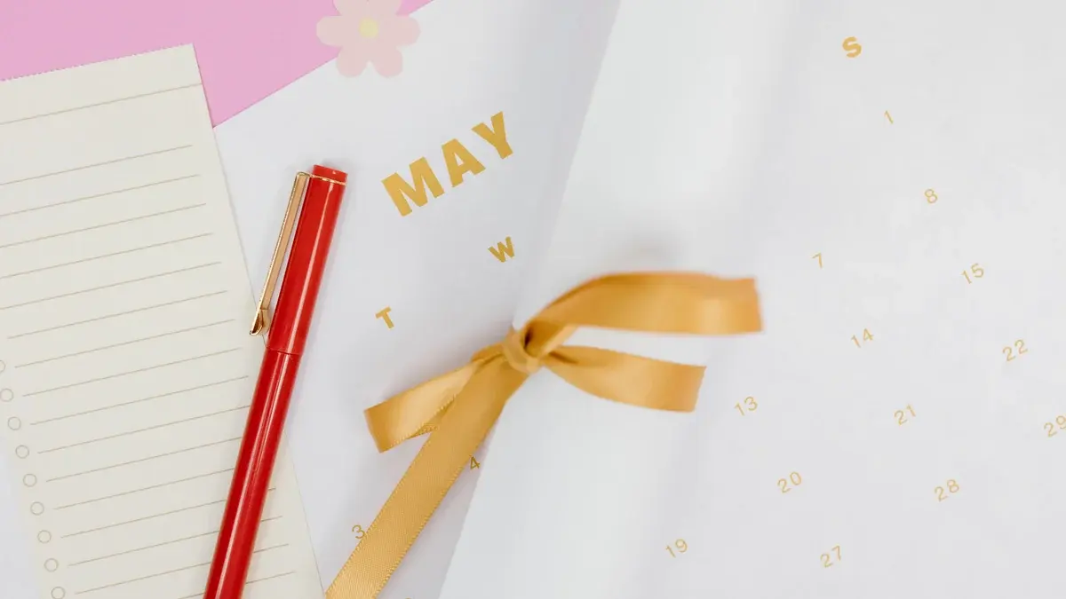Calendar page for May with a red pen